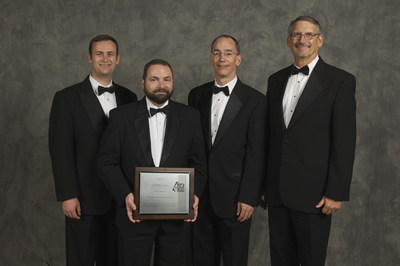 Chris Hovde of Southwest Sciences and Dayle McDermitt, Douglas Allyn and Bill Miller of LI-COR  accept the 2010 R&D 100 Award